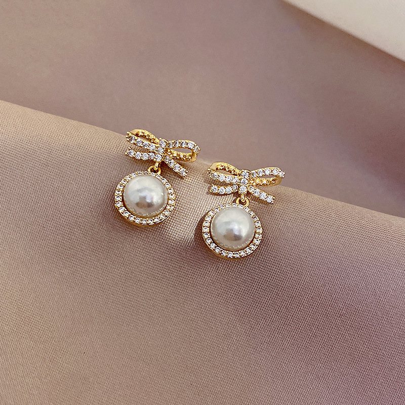 wholesale jewelry simple bow pearl alloy diamond earrings Nihaojewelrypicture1