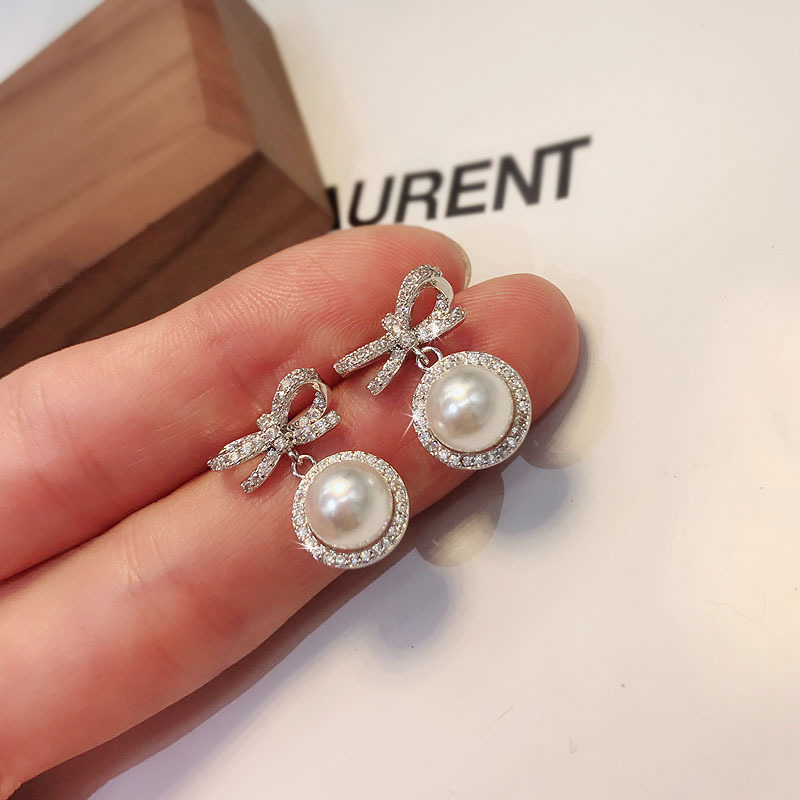 wholesale jewelry simple bow pearl alloy diamond earrings Nihaojewelrypicture4