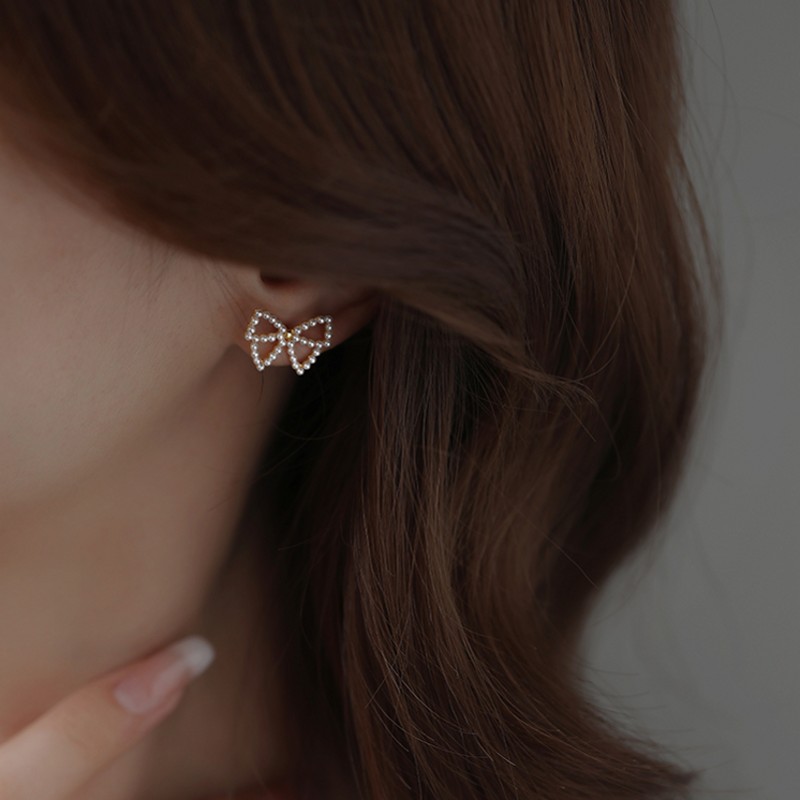 Korean simple small pearl bow alloy stud earringspicture4