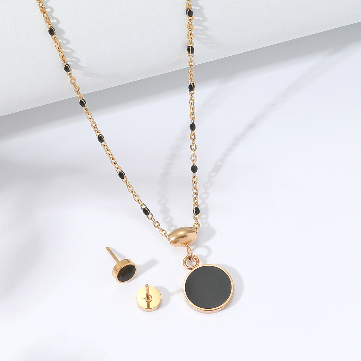 Fashion Stainless Steel 18K Gold Plated Black Enamel Round Necklace Earrings Setpicture1